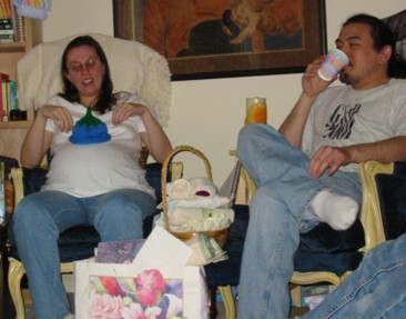 Dani and James with the baby wearing the hat Dani and James with the baby wearing the hat
